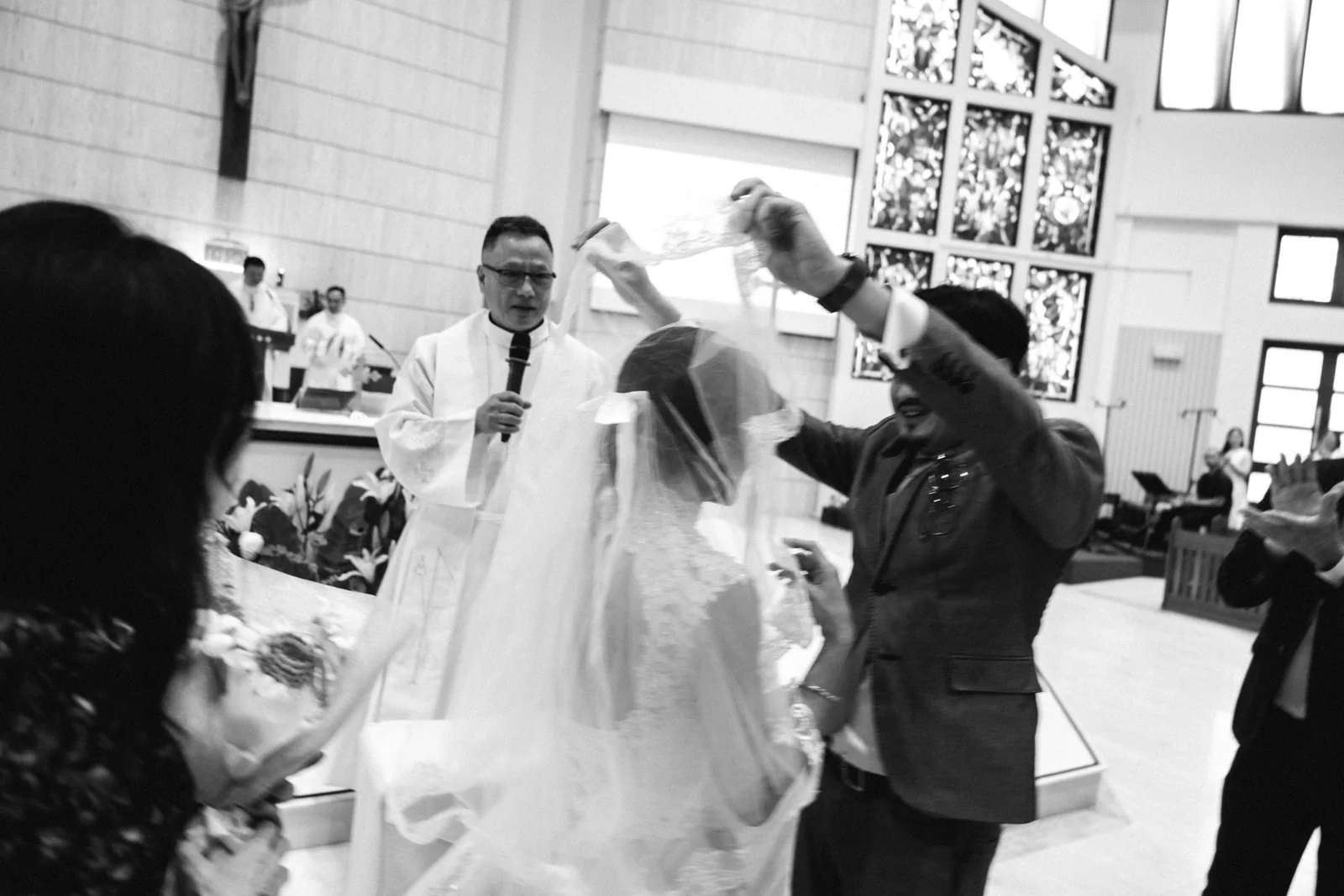 Loved ones gathered around the bride during wedding preparations