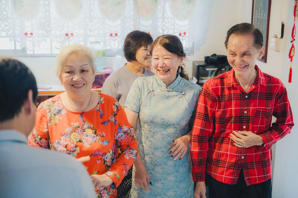 Family members smiling together during Darren and Jerrice’s wedding morning