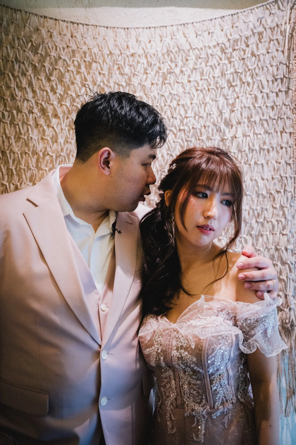 Jason holding Belle close during their wedding celebration
